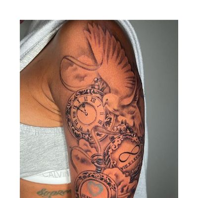 The tattoo covers her entire left arm.